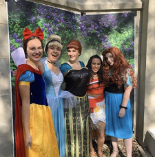 photo of Magical Memories volunteers in Disney Princess costumes